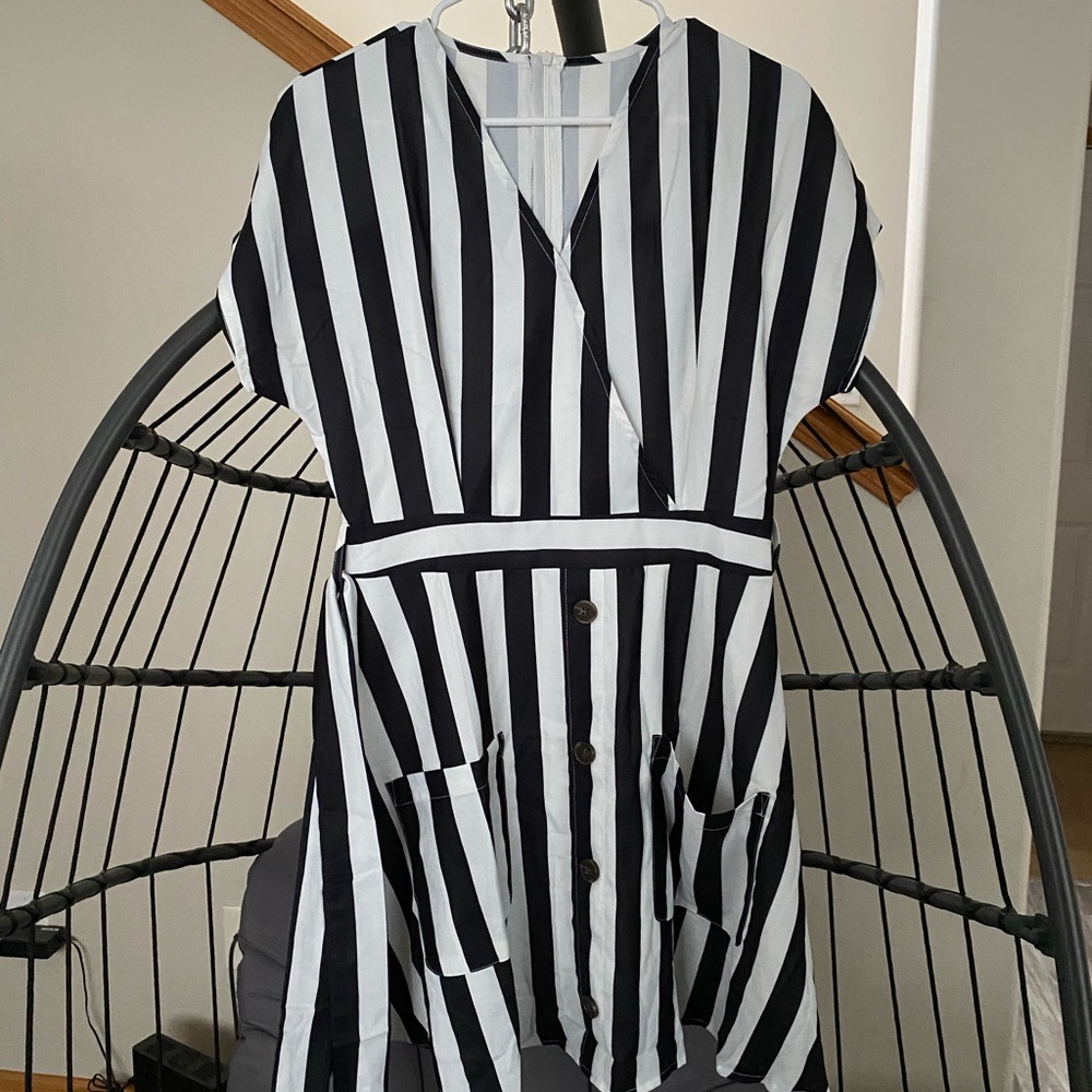 Black and white dress with front buttons and tie.